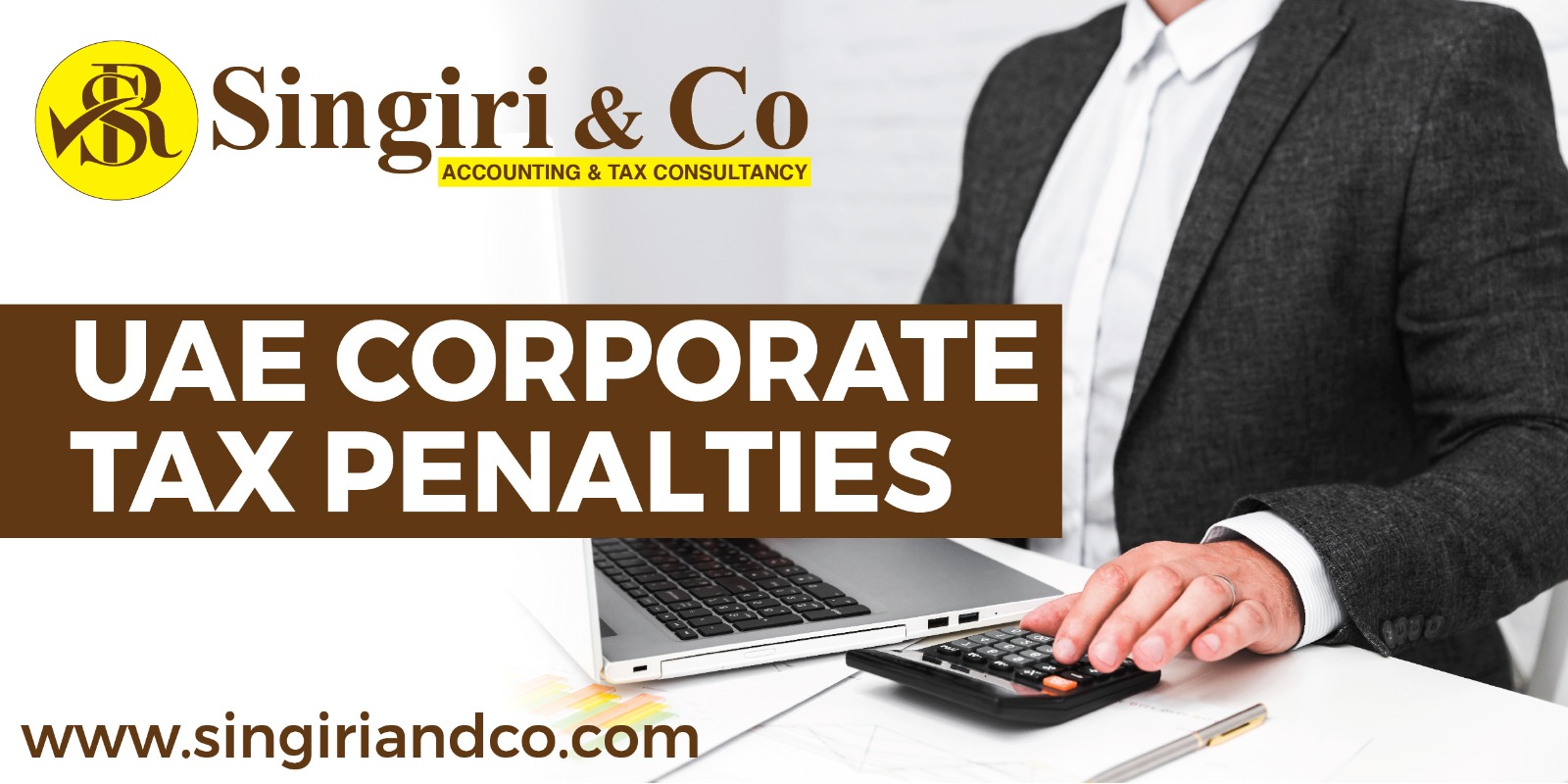 A man using a laptop and calculating the accounts to keep updated about corporate tax penalties.